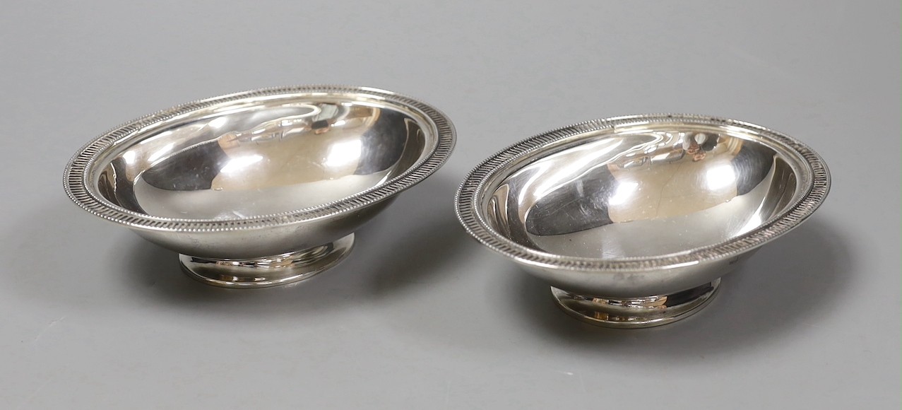A pair of George V silver oval pedestal nut dishes, by Mappin & Webb, Birmingham, 1929, 12.7cm, 142 grams.